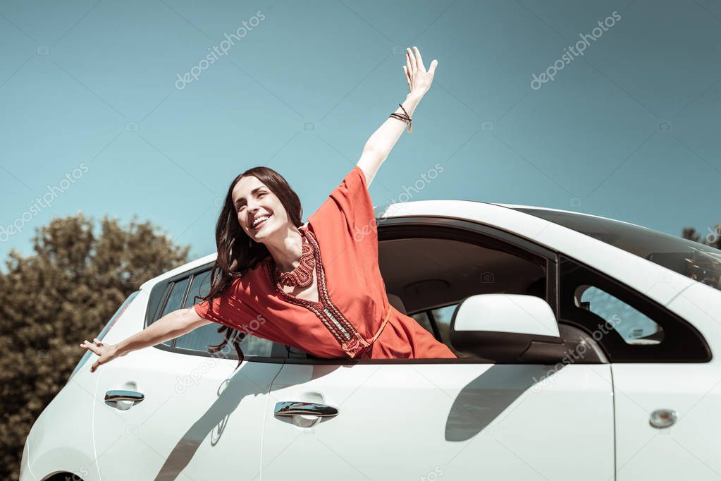 Happy young female person enjoying warm day