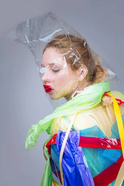 Model hardly breathing having plastic bag in head while posing — Stock Photo, Image