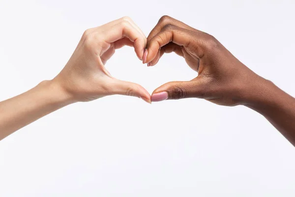 Women with different skin color making heart out of hands — Stock Photo, Image
