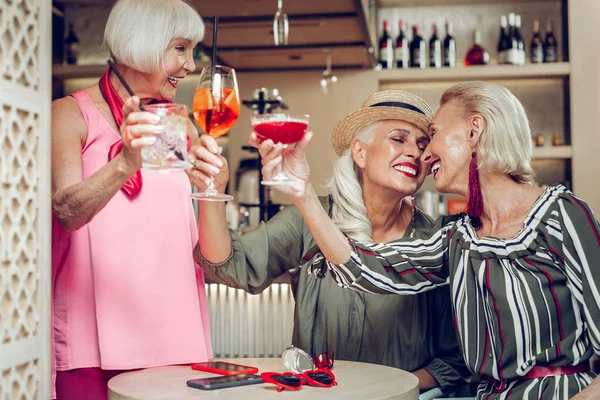 Feliz positivo anciano mujeres disfrutando de su reunión —  Fotos de Stock