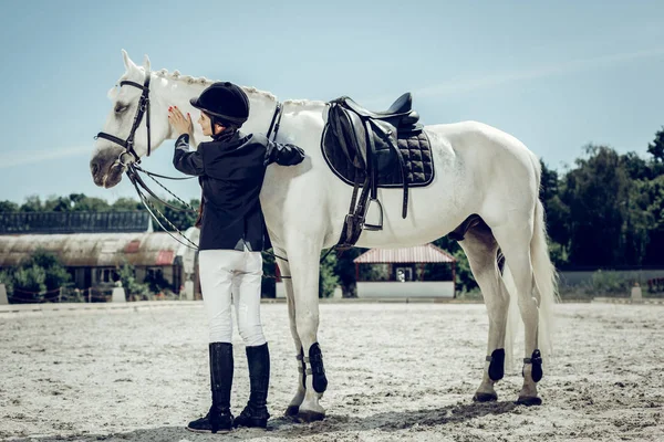 Joyful nice woman wanting to ride a horse — Stock Photo, Image