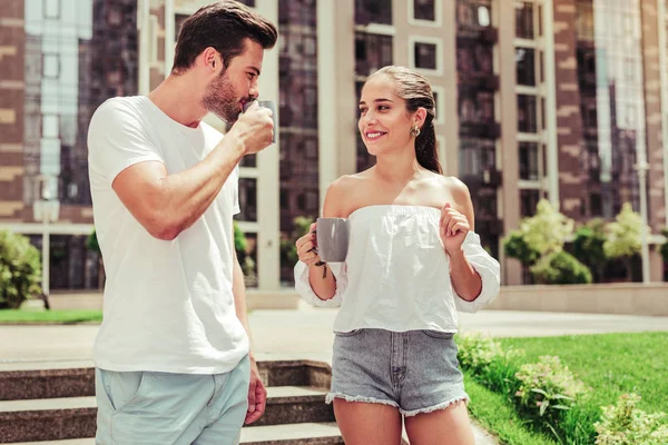 Positive delighted female person looking at her partner — Stock Photo, Image