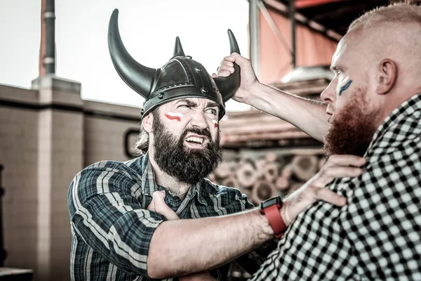 Aggressively disposed football fans fighting in pub. — Stock Photo, Image