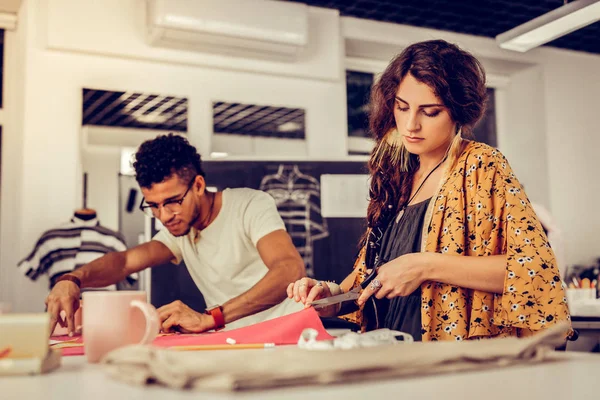 Young tailors sewing new pieces of clothing. — 스톡 사진