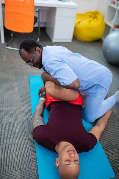 Man coming to private clinics and having physical therapy for legs