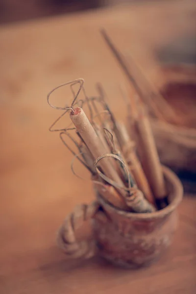 Top view of carving instruments standing in the cup — Stock Photo, Image