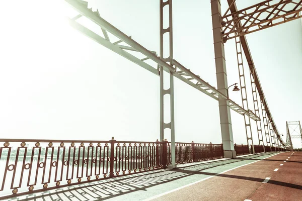 Pedestrian bridge over the river in the city