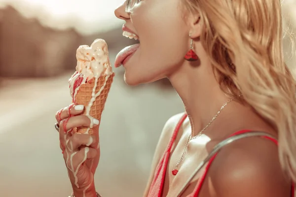 Close-up blonde bewitching young beauty going to leak an ice-cream — Stock Photo, Image