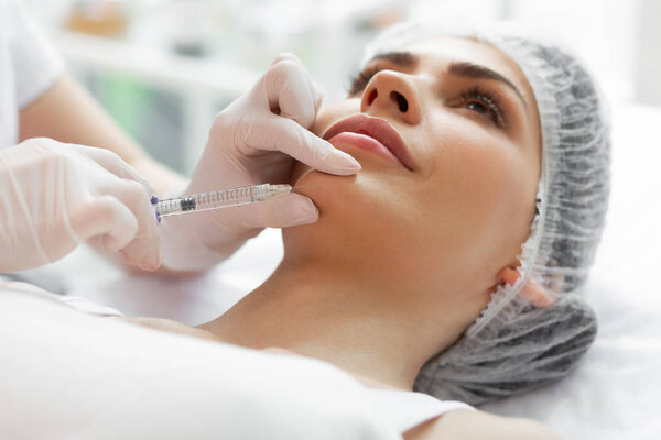 Close up of a female face during the injection