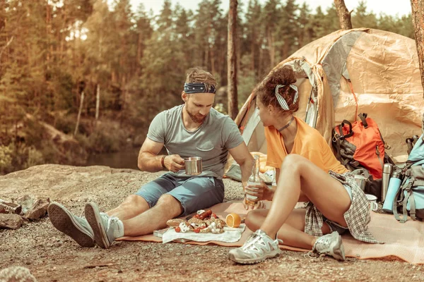 Pleasant young couple enjoying their nice picnic — Stock Photo, Image