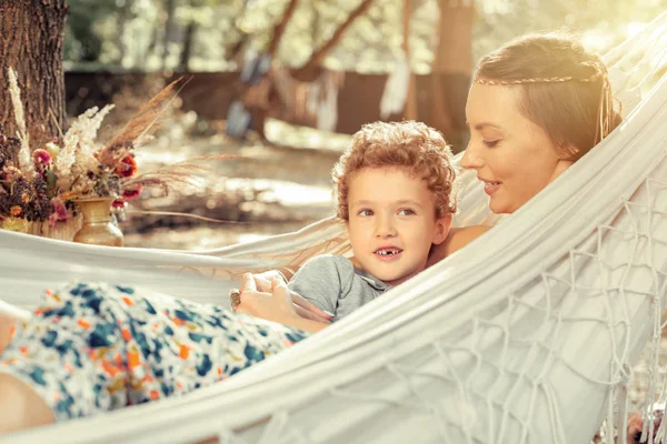 Joyful cute boy resting together with his mother — Stock Photo, Image