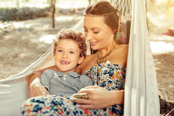 Cheerful cute boy enjoying being in a hammock — Stock Photo, Image