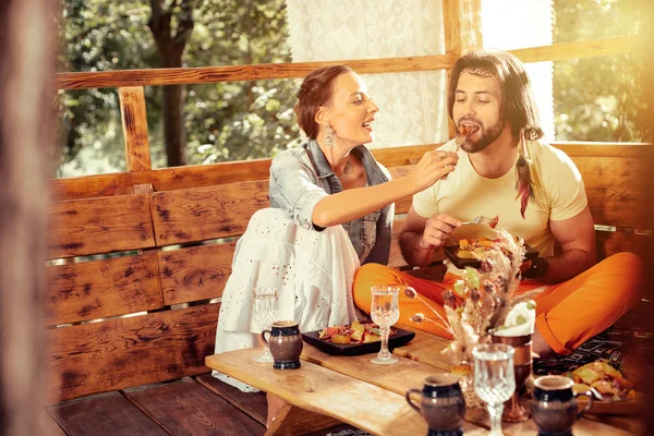 Nice joyful woman caring about her husband — Stock Photo, Image