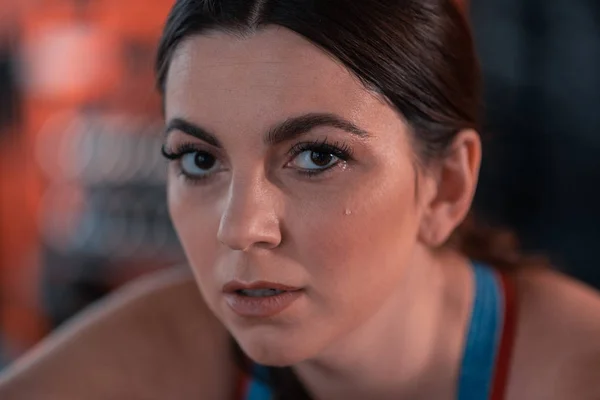 Woman working on weight loss sweating after workout