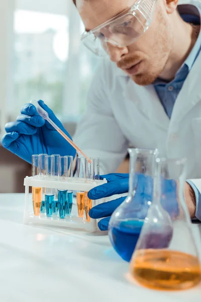 Smart male scientist focusing on his task — Stock Photo, Image