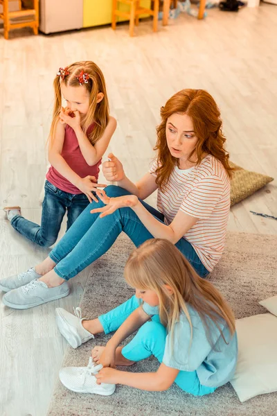 Top view of a beautiful nice woman with kids — Stock Photo, Image