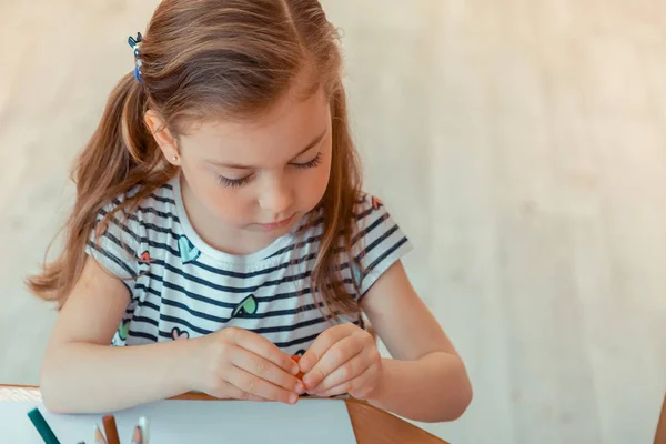 Nice cute girl holding a piece of modeling clay — Stock Photo, Image