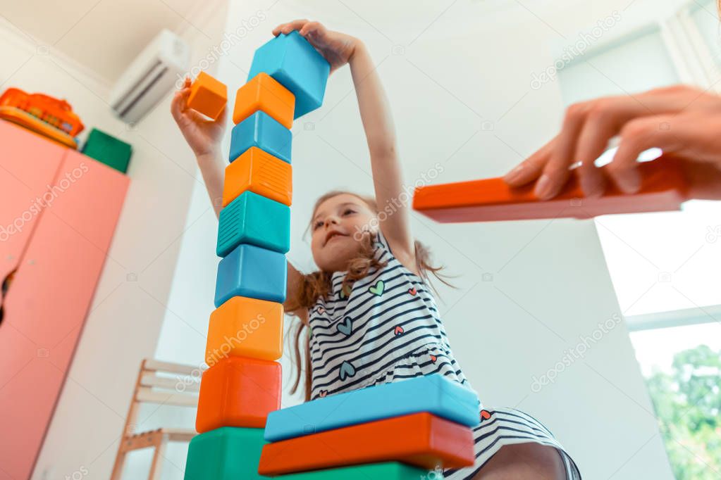 Low angle of a tower from toy blocks