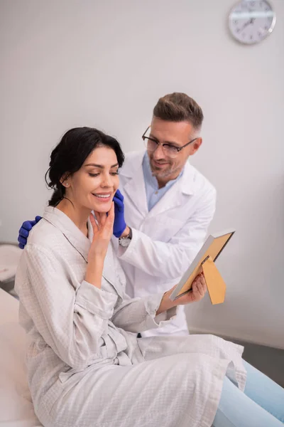 Beautiful businesswoman feeling satisfied after anti-aging procedures — Stock Photo, Image