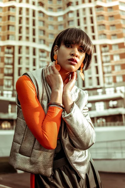 Attentive young brunette model posing on camera — Stock Photo, Image