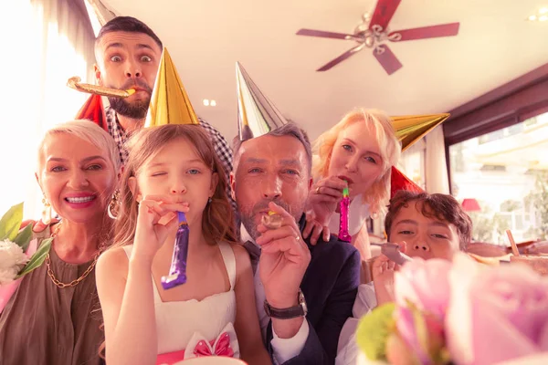 Birthday girl feeling truly happy celebrating birthday with family