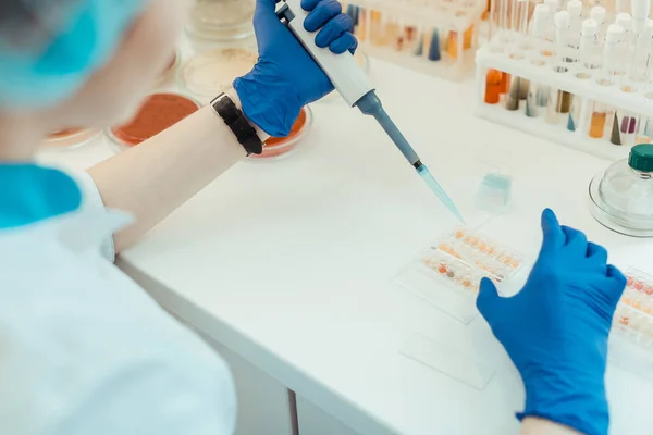 Top view of a pipette being in female hands — Stock Photo, Image