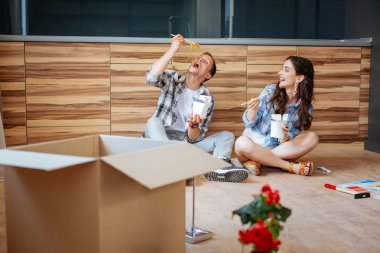 Couple laughing and eating yummy noodles in new flat clipart