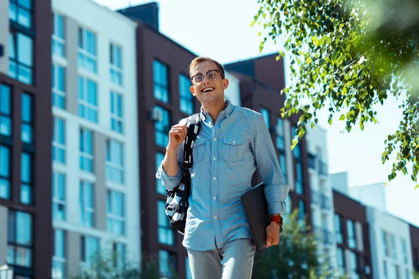 Businessman leaving residential area while walking to the office