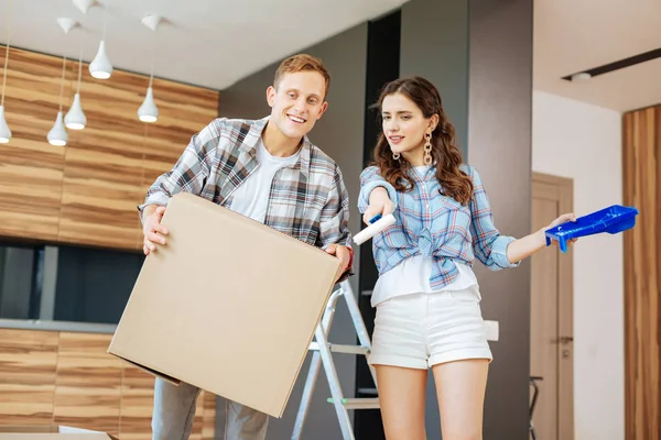 Couple discussing the interior for their future living room — Stock Photo, Image
