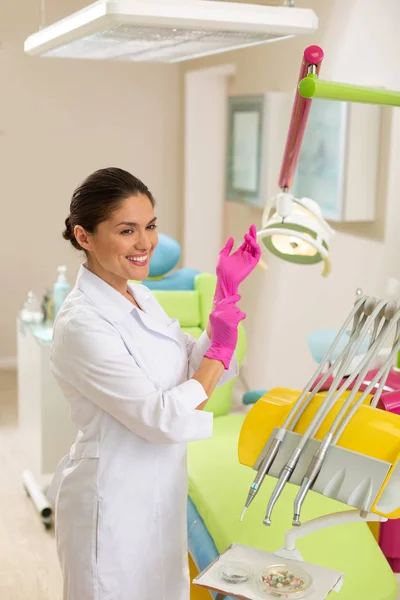 Doctor wearing a lab coat and aseptic gloves — Stock Photo, Image