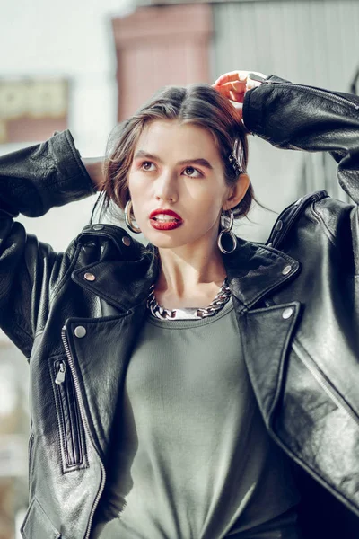 Serious stunning lady with flawless skin raising hands — Stock Photo, Image