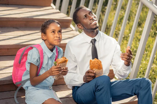 Positive delighted dad and daughter looking together at sky — Stock Photo, Image