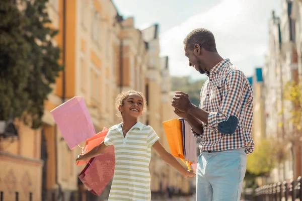 Pleased dark-skinned girl spending day with father — Stock Photo, Image