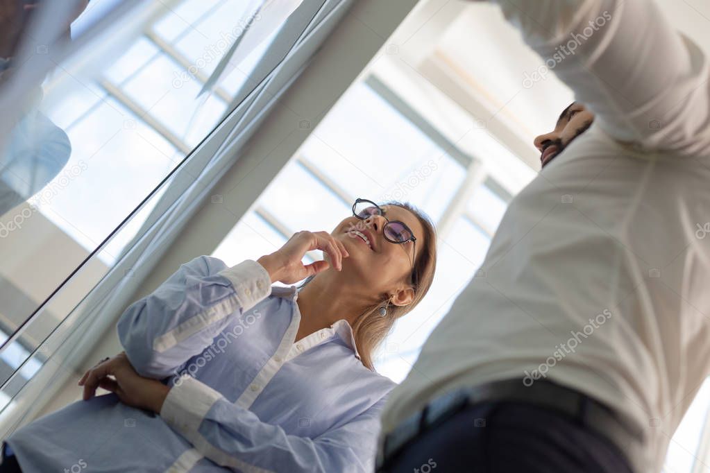 Low angle photo of partners that discussing business idea