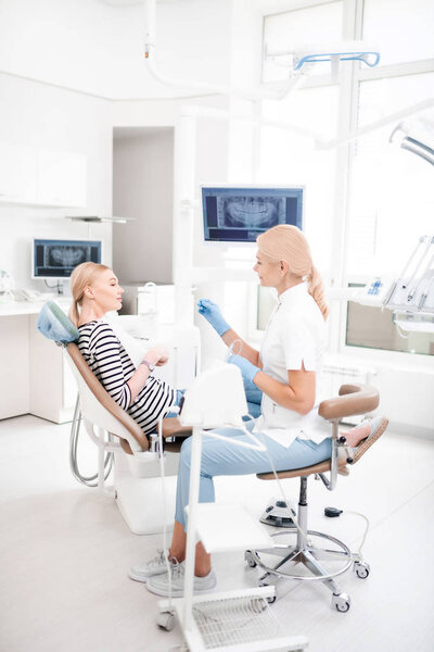 Appointment of young patient and her dentist.