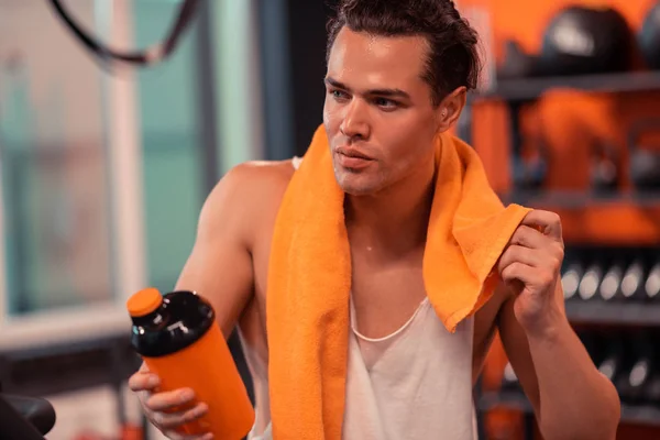 Attractive fit man sweating after the workout