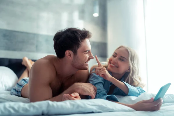 Girlfriend touching nose of her handsome man — Stock Photo, Image