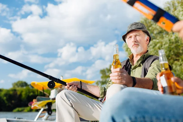 Man having serious face while fishing with son — Stock Photo, Image