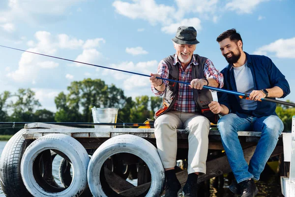 Mature adult fishing with father at the weekend — Stock Photo, Image