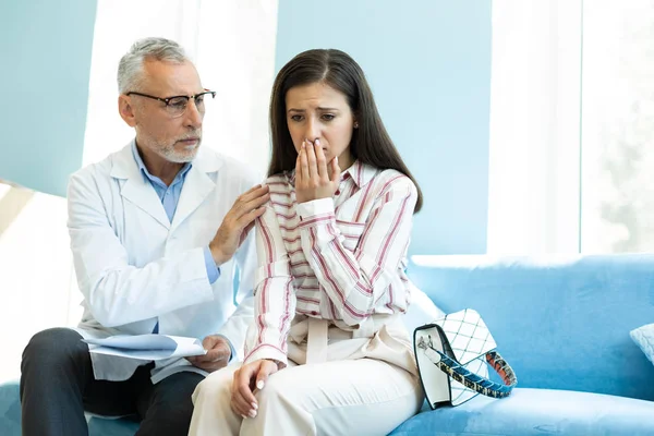 Worried brunette young woman being in all ears — Stock Photo, Image