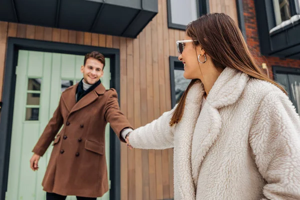 Woman taking her man for a walk — Stock Photo, Image