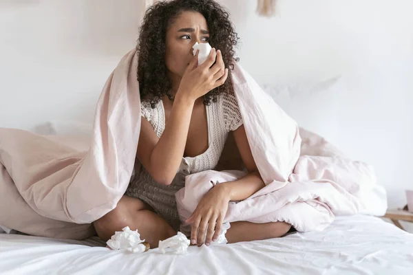 Emotional young female person suffering running nose — Stock Photo, Image