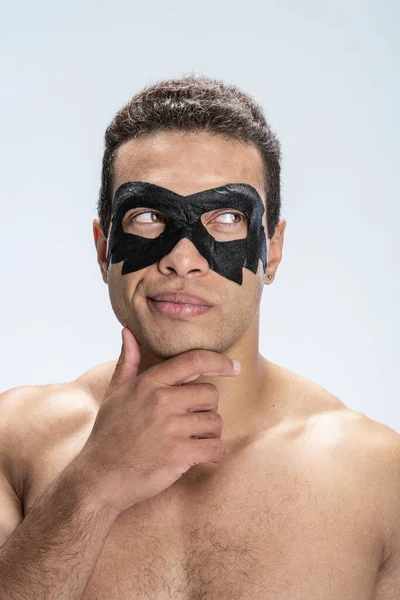 Young male imagining his face looking better — Stock Photo, Image