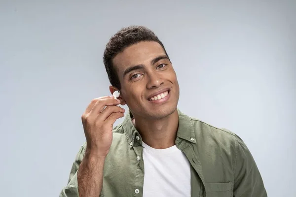 Handsome male preparing for listening to music — Stock Photo, Image