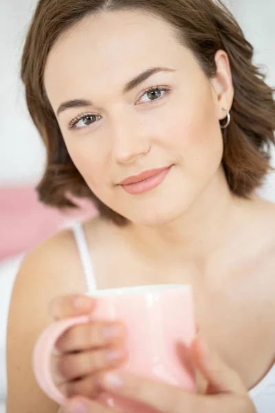 Pretty female with a cup of coffee — Stock Photo, Image
