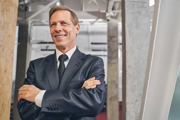 Handsome senior man waiting for his colleagues — Stock Photo, Image