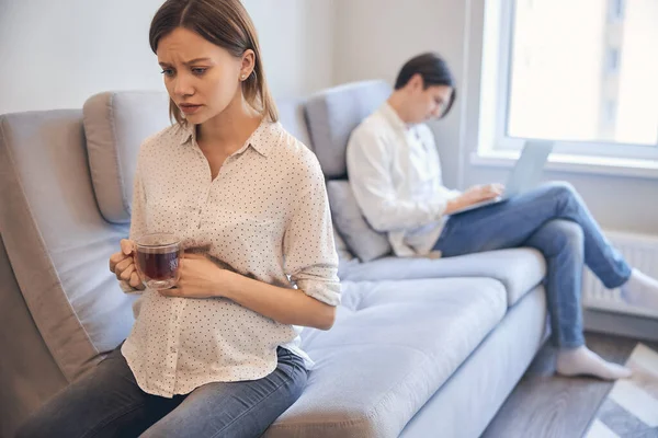 Couple after quarrel sitting far from each other — Stock Photo, Image
