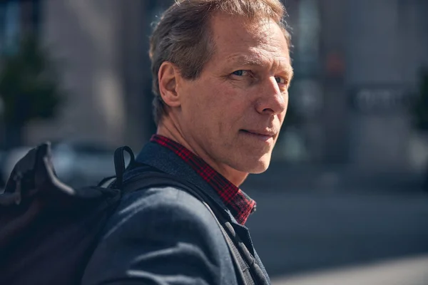 Serene middle-aged man standing on the street — Stock Photo, Image