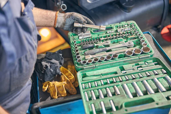 Focused photo on male hand taking spanner — Stock Photo, Image