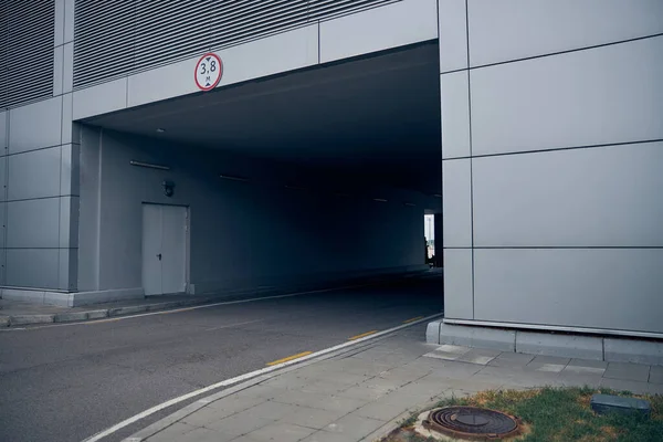 Tunnel with asphalt road at airport territory — Stock Photo, Image